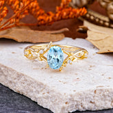 Nature-Inspired Branch-Wrapped 4-Prong Oval Aquamarine Engagement  Rings